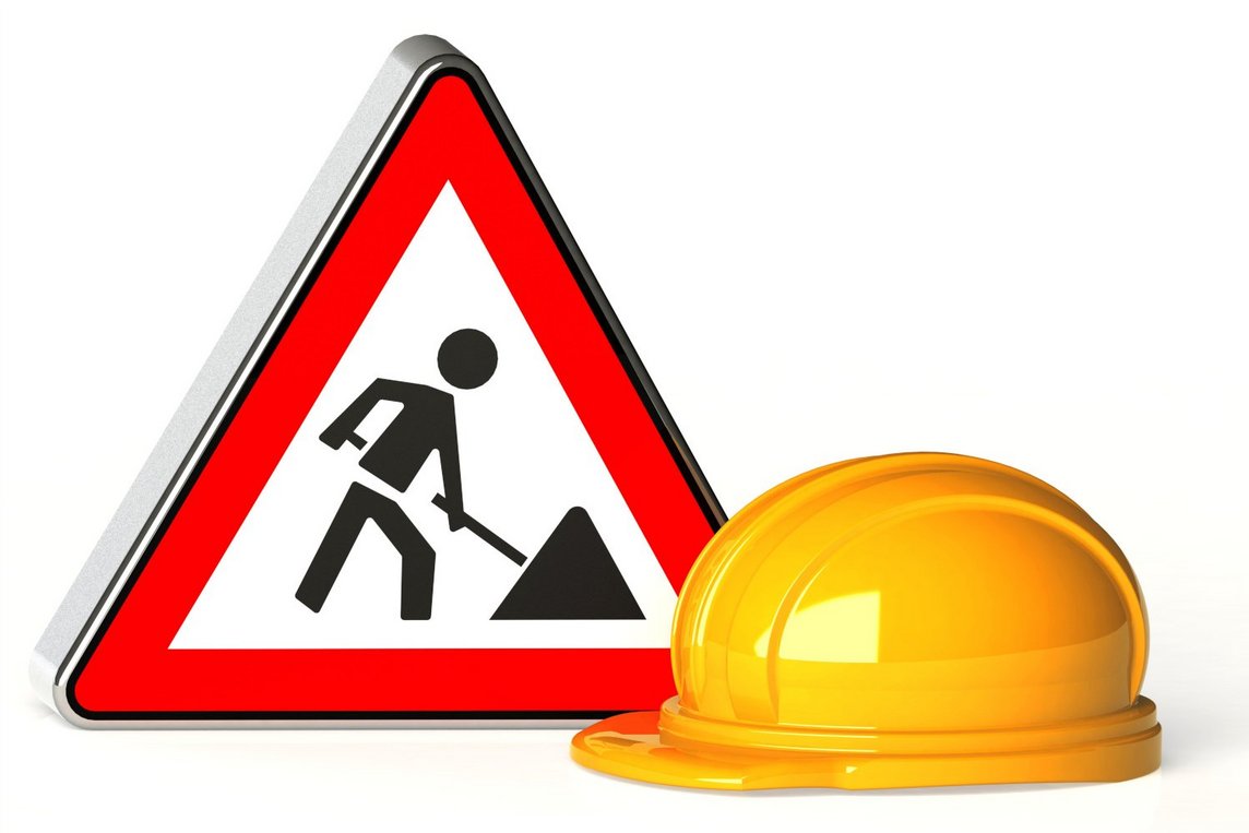 Diese Grafik zeigt einen Bauhelm und ein Baustellenschild